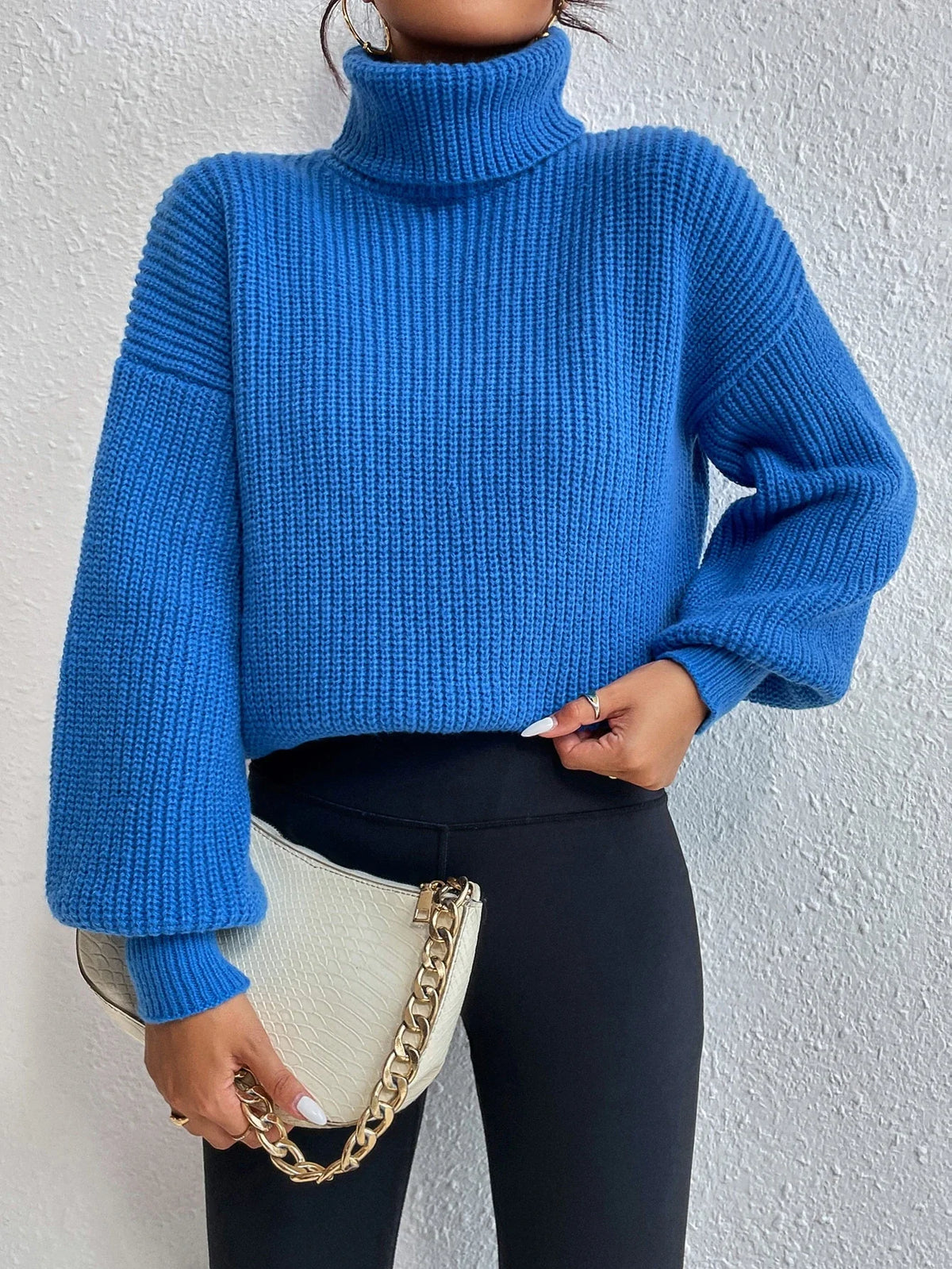 Suéter Feminino de Tricô com Gola Alta e Manga Bufante
